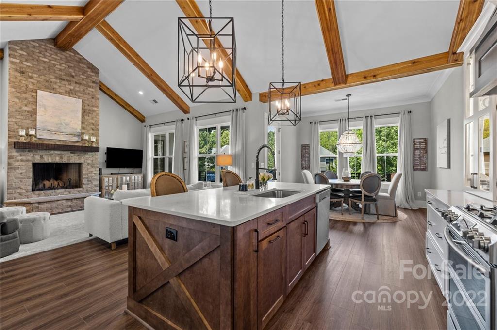 11099 Pheasant Run Tega Cay, SC 29708 - Photo 12 of 47 a kitchen with stainless steel appliances granite countertop a stove and cabinets