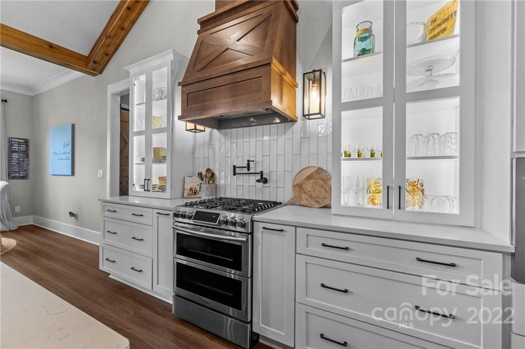 11099 Pheasant Run Tega Cay, SC 29708 - Photo 13 of 47 a kitchen with stainless steel appliances white cabinets and a window