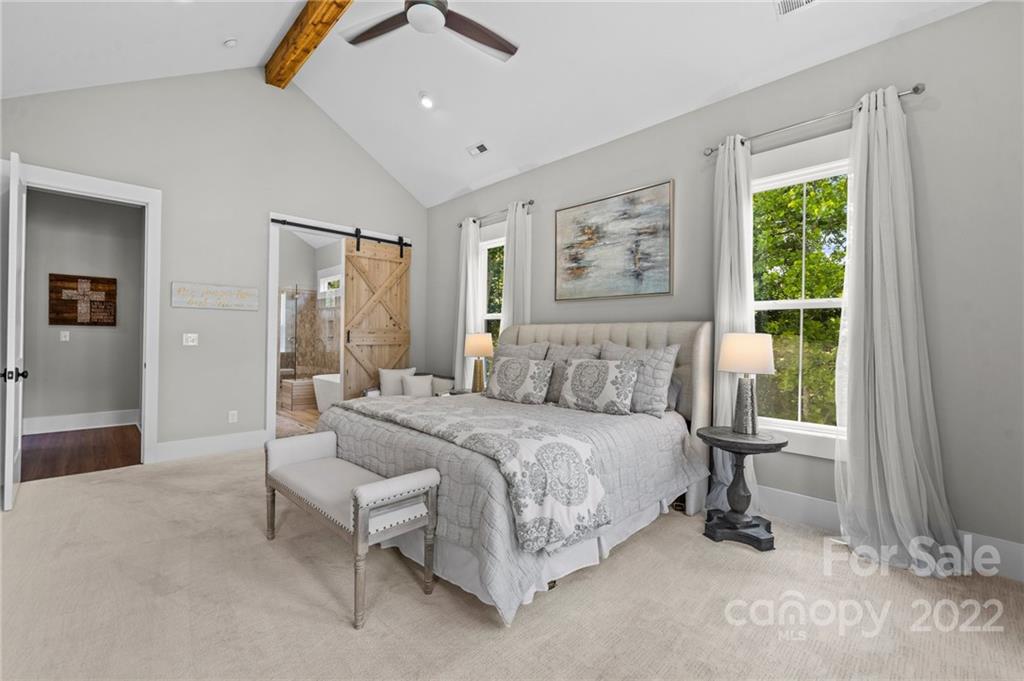 11099 Pheasant Run Tega Cay, SC 29708 - Photo 21 of 47 a bedroom with a bed and a window