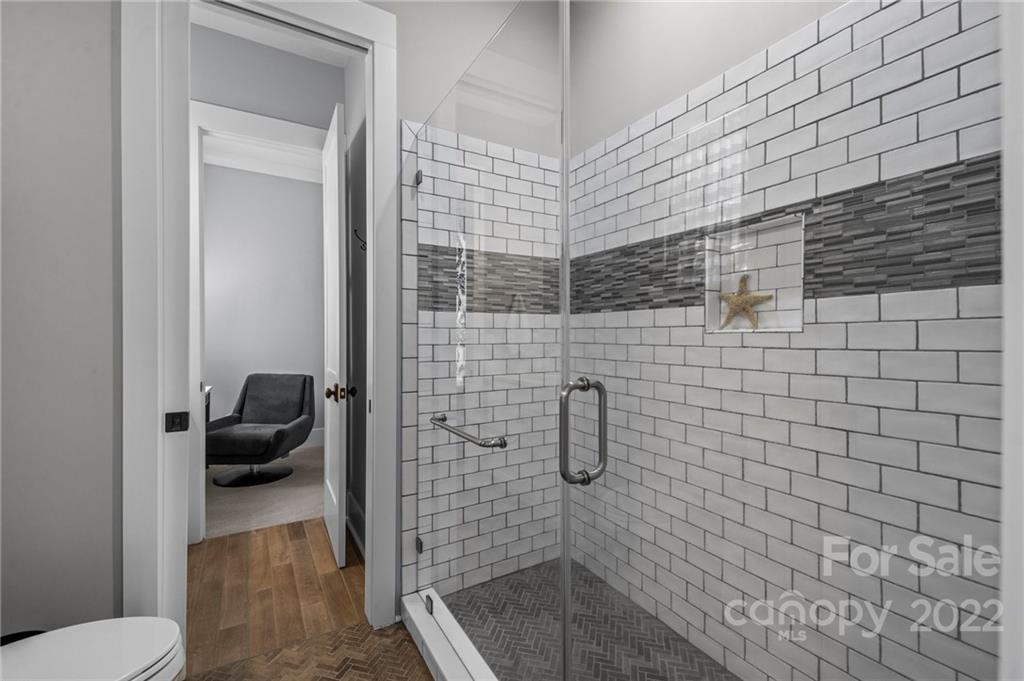 11099 Pheasant Run Tega Cay, SC 29708 - Photo 23 of 47 a bathroom with a sink and a shower