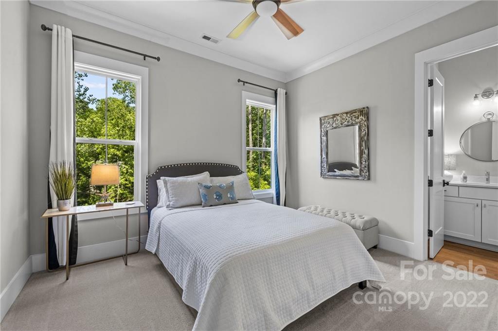 11099 Pheasant Run Tega Cay, SC 29708 - Photo 26 of 47 a bedroom with a large bed and a window