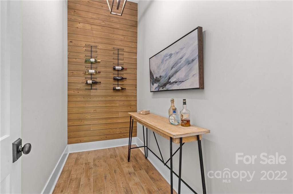 11099 Pheasant Run Tega Cay, SC 29708 - Photo 32 of 47 a bathroom with a sink and a painting on the wall