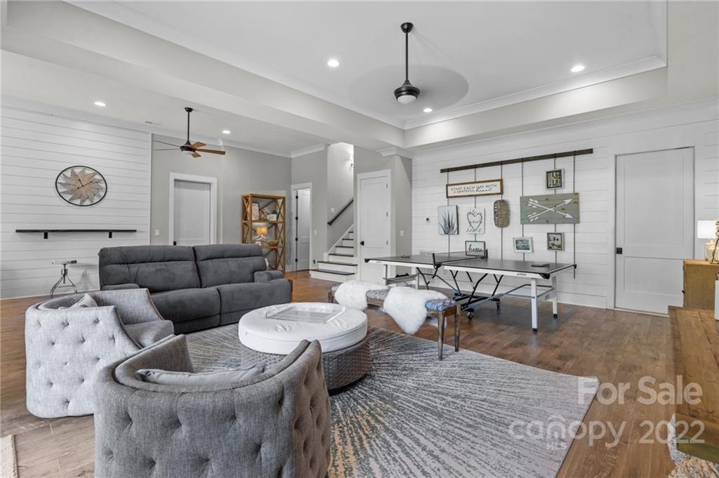11099 Pheasant Run Tega Cay, SC 29708 - Photo 38 of 47 a living room with furniture a rug and white walls