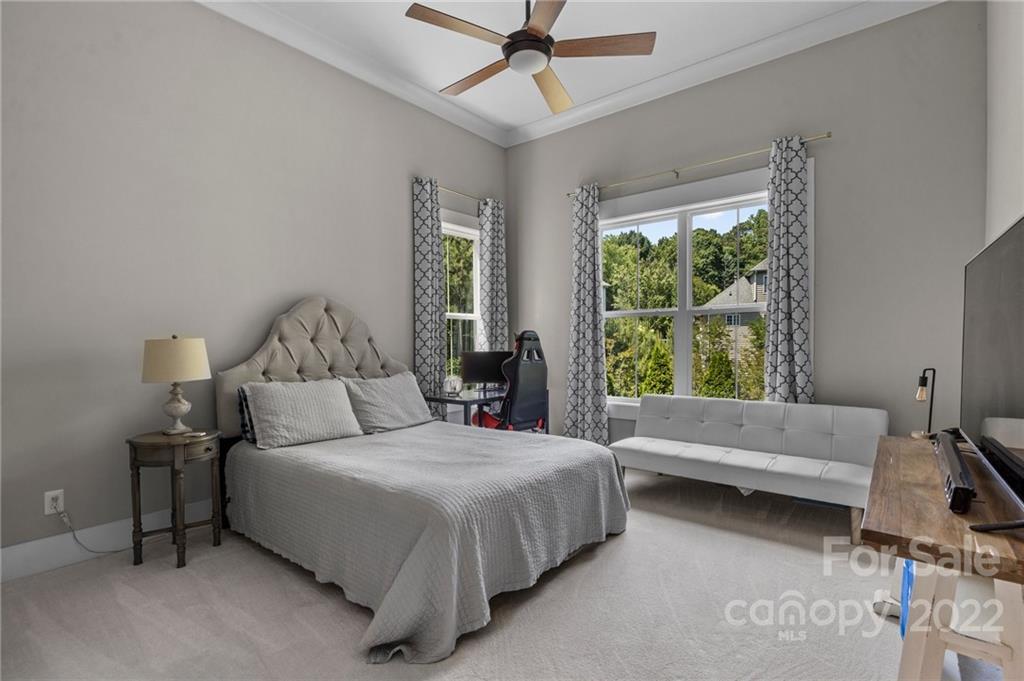 11099 Pheasant Run Tega Cay, SC 29708 - Photo 39 of 47 a bedroom with a bed and a window