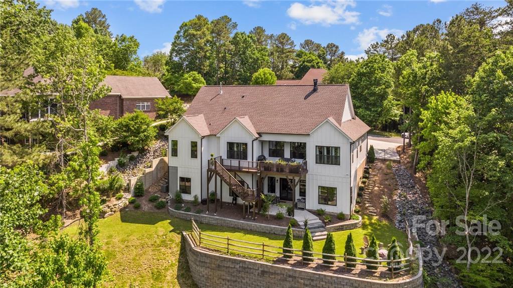 11099 Pheasant Run Tega Cay, SC 29708 - Photo 41 of 47 an aerial view of a house with swimming pool garden and patio