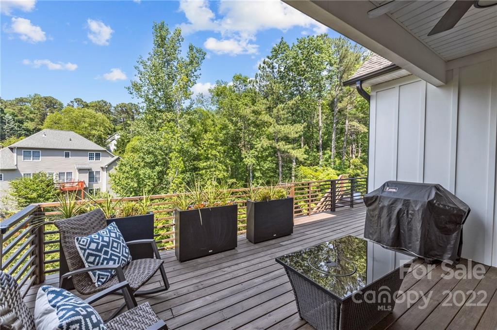 11099 Pheasant Run Tega Cay, SC 29708 - Photo 5 of 47 a view of a patio with couches table and chairs and potted plants