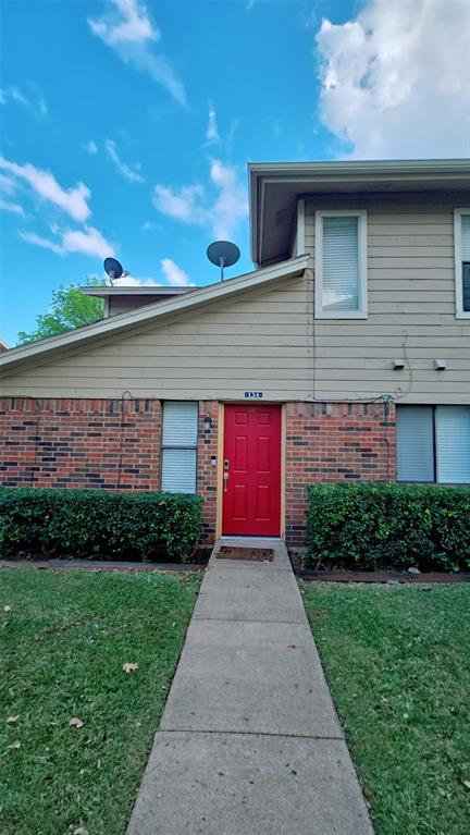 2240 Tarpley Road, Unit 134 Carrollton, TX 75006 - Photo 1 of 23 a front view of a house with a yard and garage