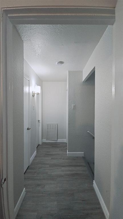 2240 Tarpley Road, Unit 134 Carrollton, TX 75006 - Photo 20 of 23 a view of hallway with wooden floor