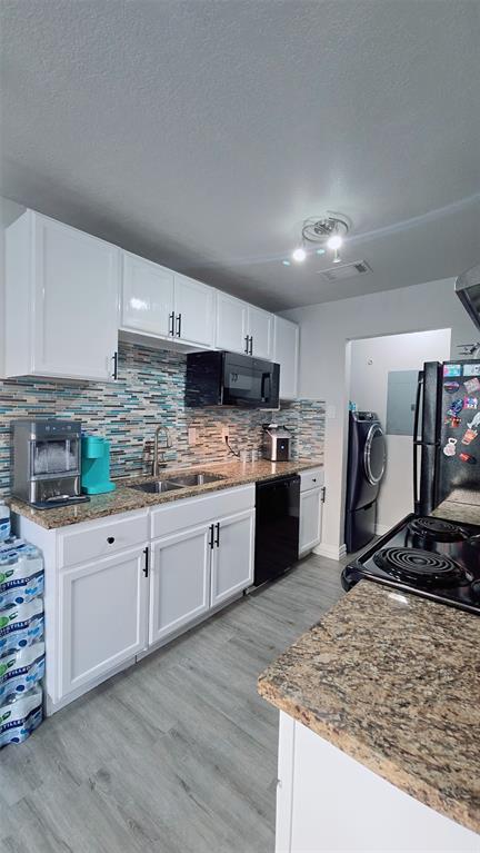 2240 Tarpley Road, Unit 134 Carrollton, TX 75006 - Photo 2 of 23 a kitchen with stainless steel appliances granite countertop a sink stove and refrigerator