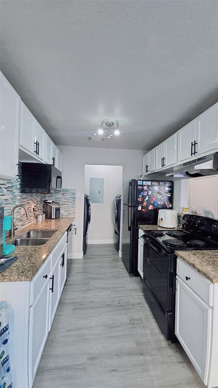 2240 Tarpley Road, Unit 134 Carrollton, TX 75006 - Photo 6 of 23 a large kitchen with a stove top oven