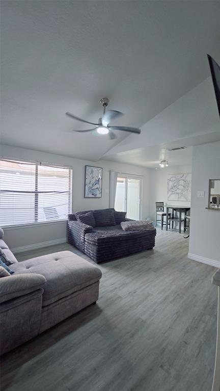 2240 Tarpley Road, Unit 134 Carrollton, TX 75006 - Photo 7 of 23 a living room with furniture and windows