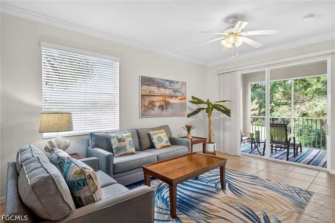8251 Pathfinder Loop, Unit 621 Fort Myers, FL 33919 - Photo 5 of 30 a living room with furniture and a large window