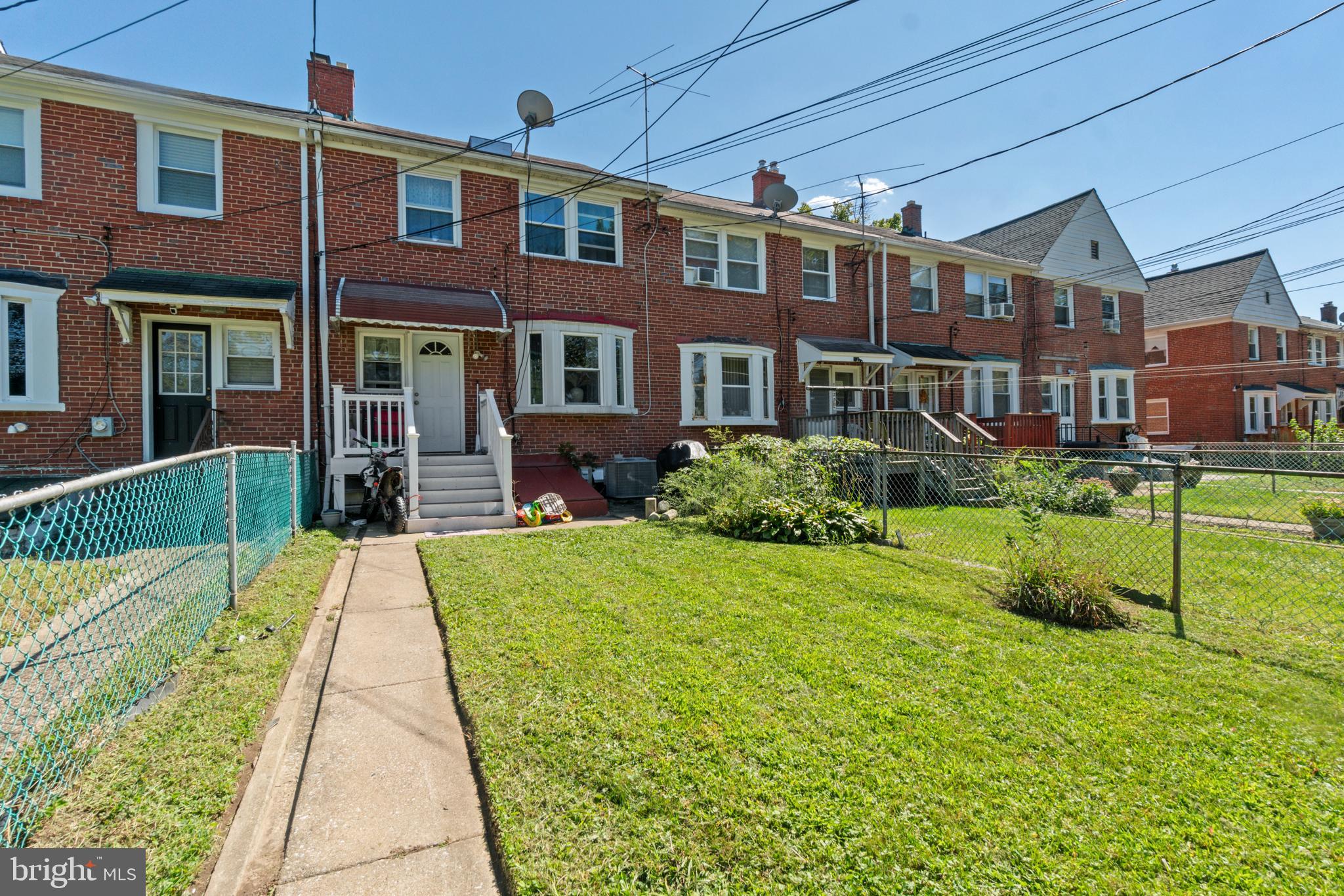 1322 East Cold Spring Lane Baltimore, MD 21239 - Photo 20 of 21 a front view of a house with a yard