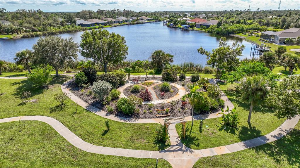 9357 Agate Street Port Charlotte, FL 33981 - Photo 8 of 17 an aerial view of a house with outdoor space and lake view
