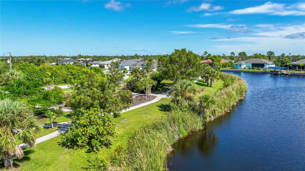 9357 Agate Street Port Charlotte, FL 33981 - Photo 10 of 17 a view of a lake with houses in the back