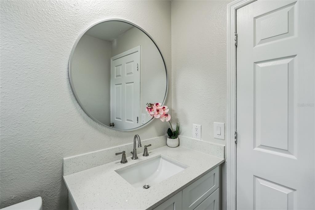 224 Singleton Avenue Arcadia, FL 34266 - Photo 14 of 24 a bathroom with a sink and a mirror