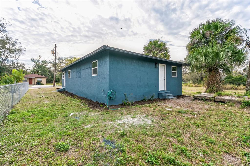224 Singleton Avenue Arcadia, FL 34266 - Photo 21 of 24 a backyard of a house with lots of green space
