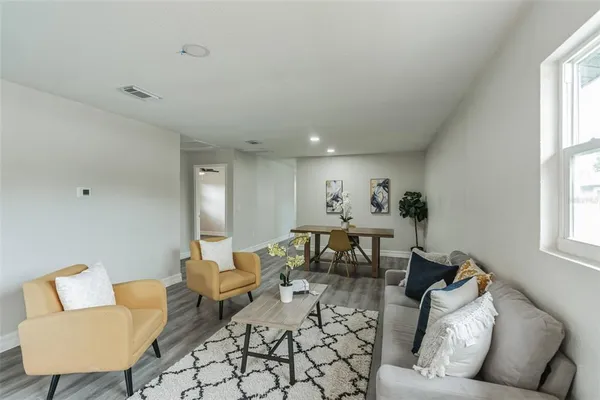 a living room with furniture and a window