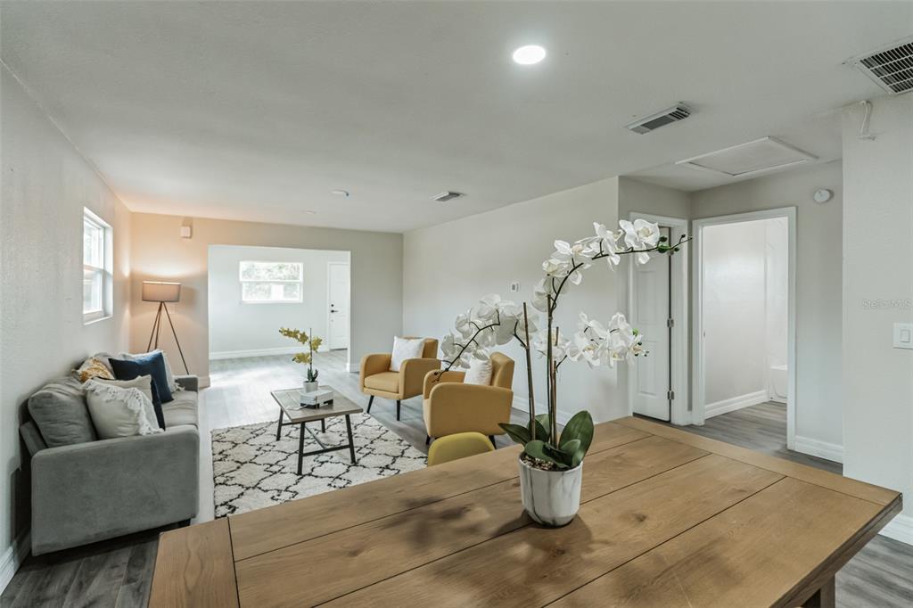 224 Singleton Avenue Arcadia, FL 34266 - Photo 6 of 24 a living room with furniture and a chandelier