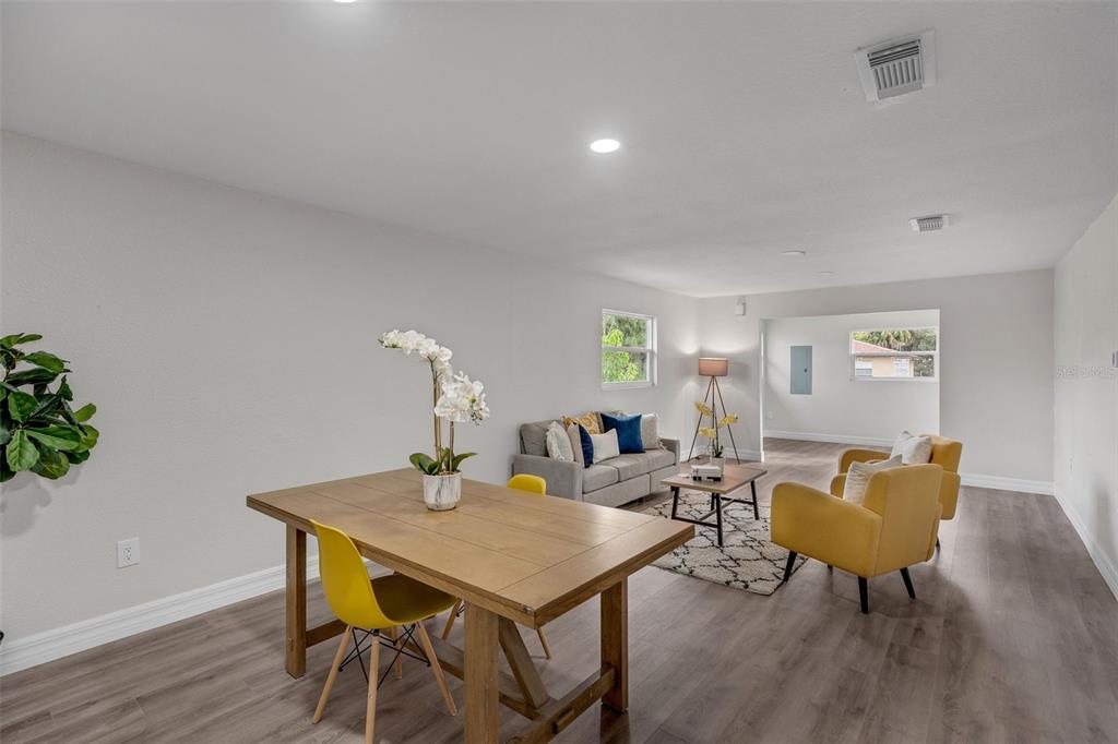 224 Singleton Avenue Arcadia, FL 34266 - Photo 7 of 24 a view of a dining room with furniture and wooden floor
