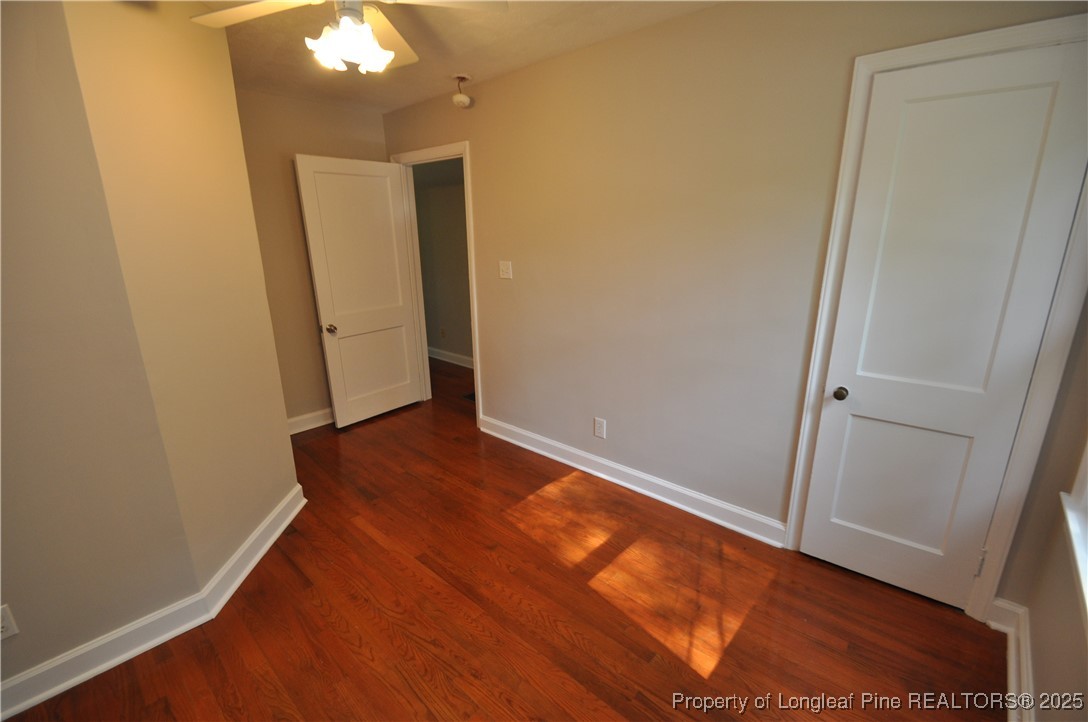 326 Webster Street Cary, NC 27511 - Photo 14 of 20 an empty room with wooden floor