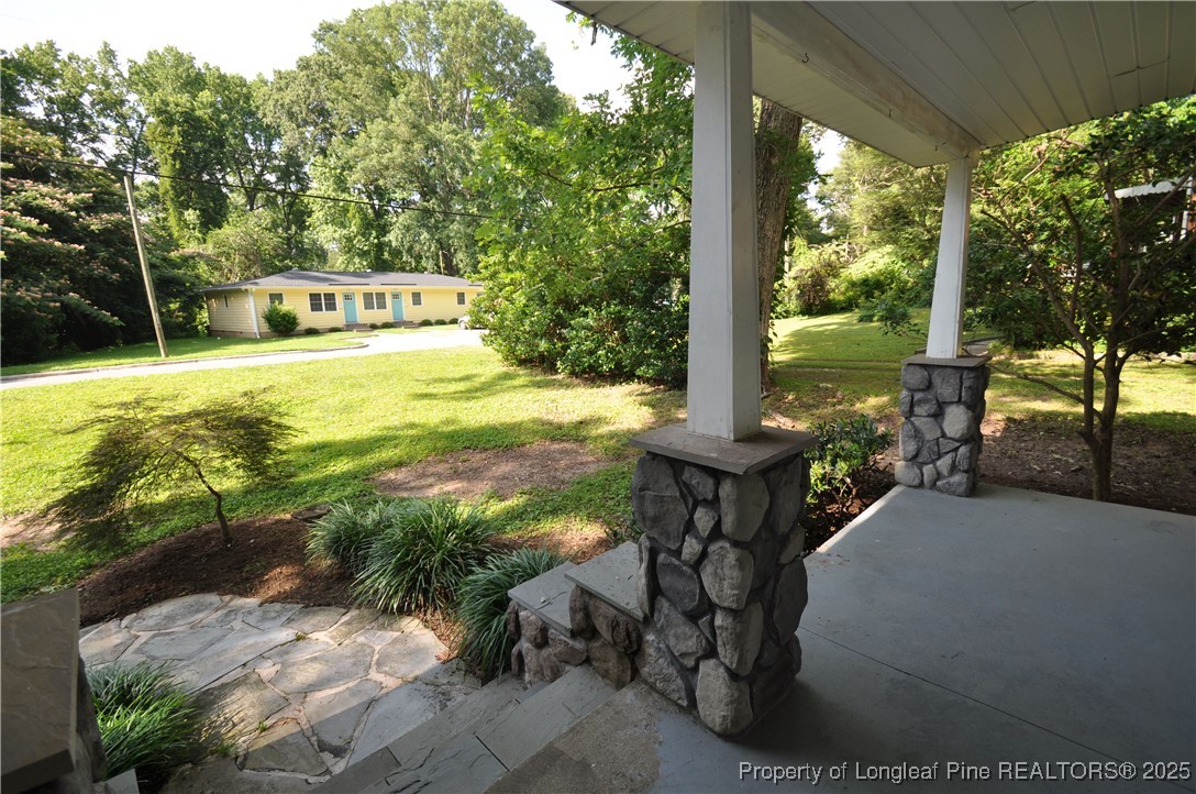 326 Webster Street Cary, NC 27511 - Photo 3 of 20 a view of a chairs and table in the patio