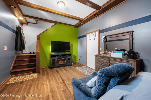 a bed sitting in a room next to a window