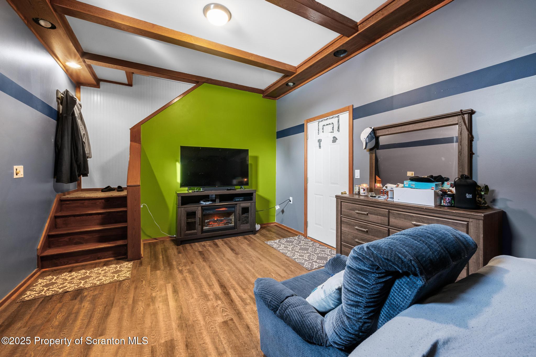 176 Poplar Street Archbald, PA 18403 - Photo 21 of 34 a living room with furniture and a flat screen tv