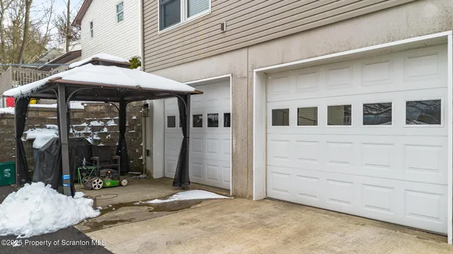 a view of a house with a patio and a yard
