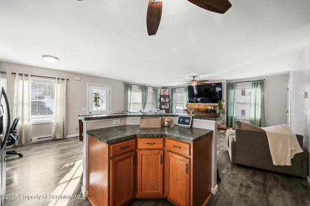 a kitchen with a stove a sink and a refrigerator