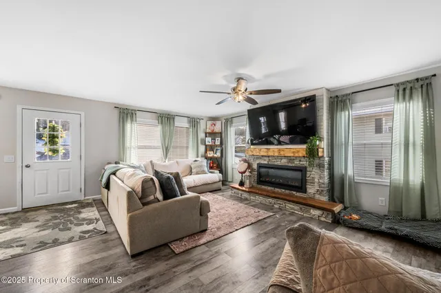 a living room with furniture and a fireplace