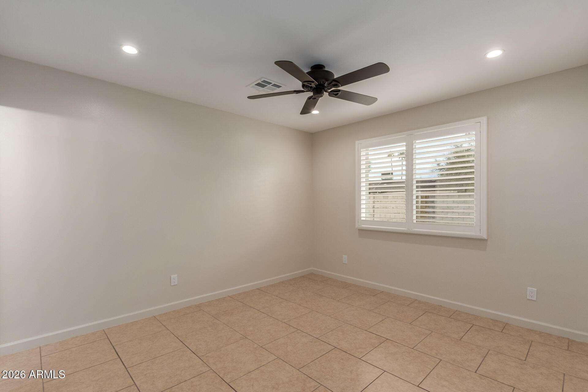 1628 East Del Rio Drive Tempe, AZ 85282 - Photo 21 of 32 a view of an empty room with a window