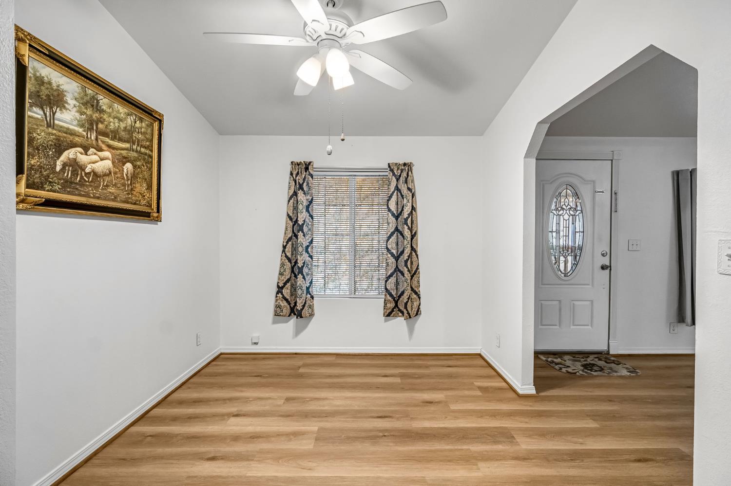 1218 East Cleveland Avenue, Unit 142 Madera, CA 93638 - Photo 15 of 32 a view of a livingroom with wooden floor and closet