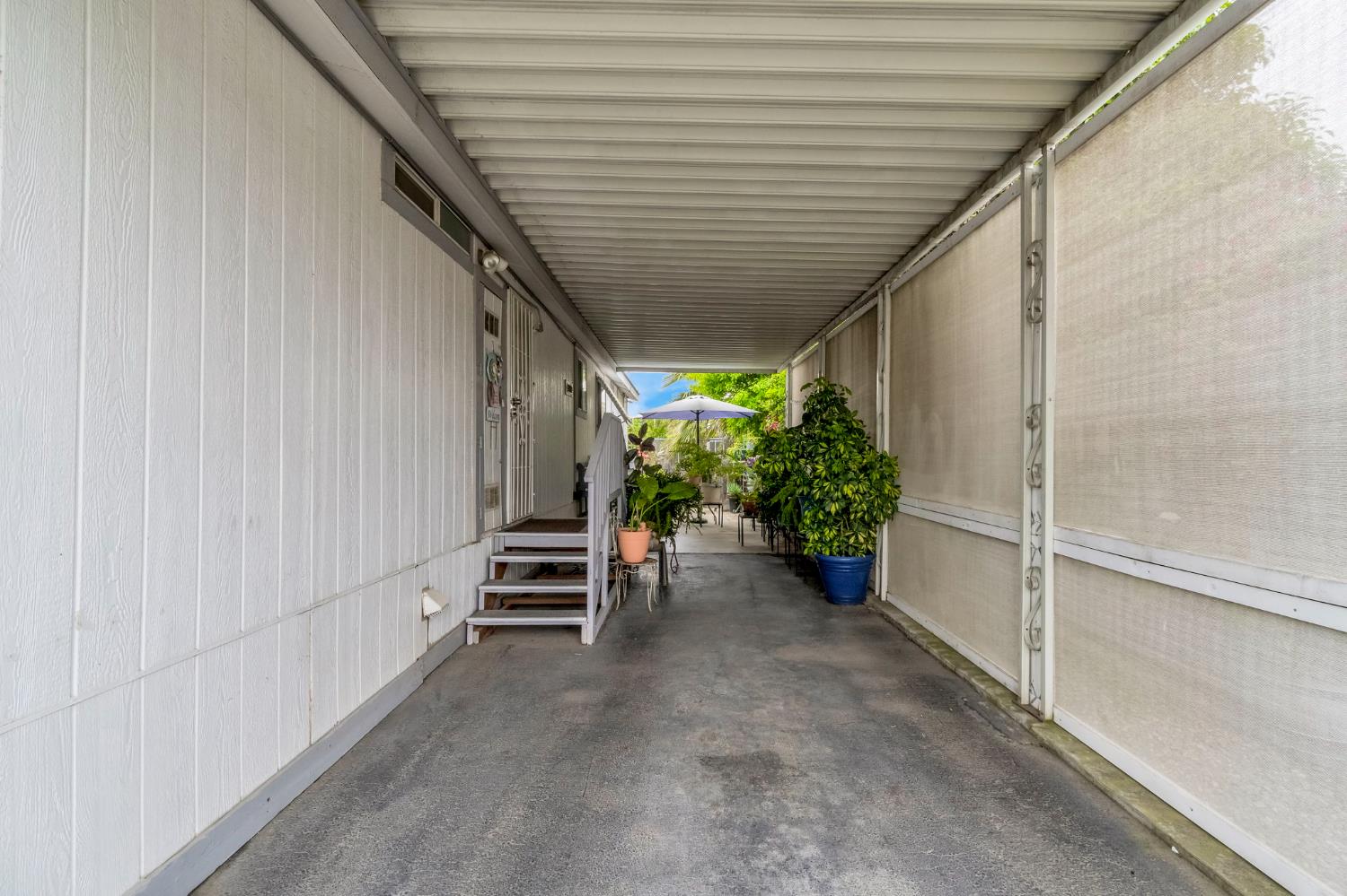 1218 East Cleveland Avenue, Unit 142 Madera, CA 93638 - Photo 27 of 32 a view of a porch