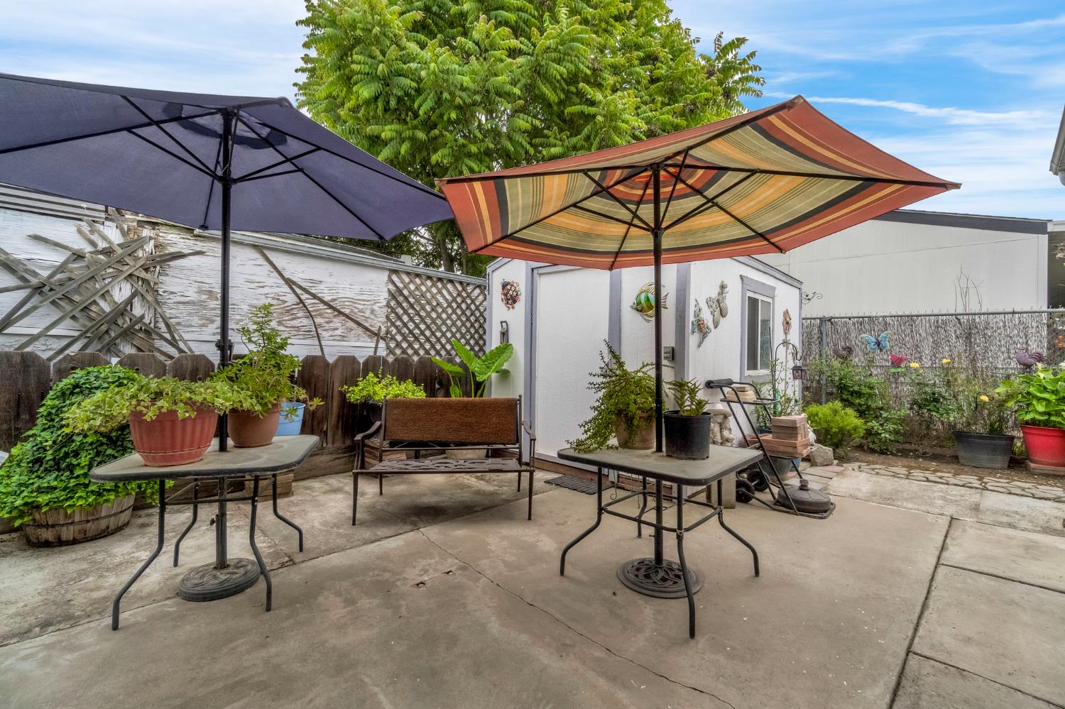 1218 East Cleveland Avenue, Unit 142 Madera, CA 93638 - Photo 32 of 32 a view of a chair and table in the patio