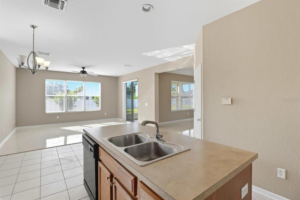 4059 Southwest 51st Road Ocala, FL 34474 - Photo 18 of 42 a kitchen with a sink and a window