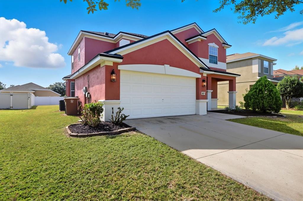 4059 Southwest 51st Road Ocala, FL 34474 - Photo 3 of 42 a front view of a house with a yard