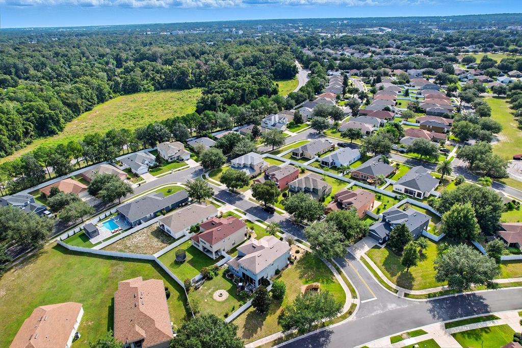 4059 Southwest 51st Road Ocala, FL 34474 - Photo 40 of 42 an aerial view of residential houses with outdoor space and trees