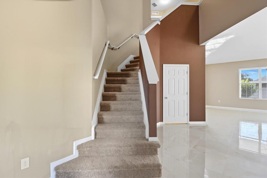 4059 Southwest 51st Road Ocala, FL 34474 - Photo 6 of 42 a view of staircase with white walls