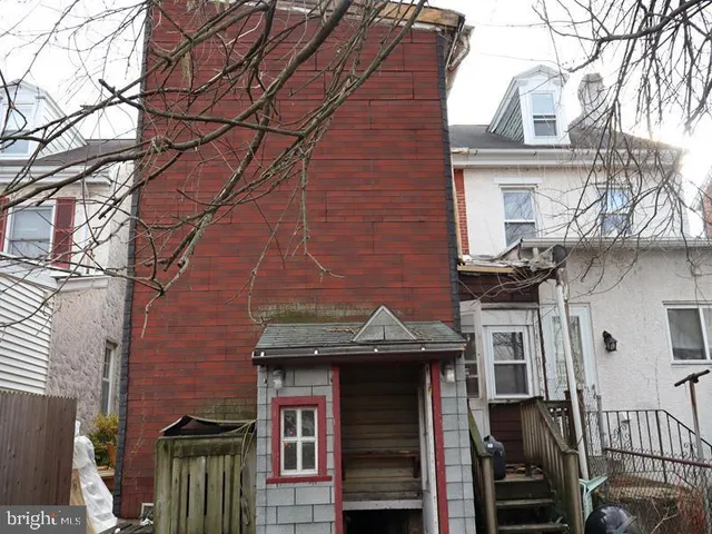 a front view of a building with glass windows