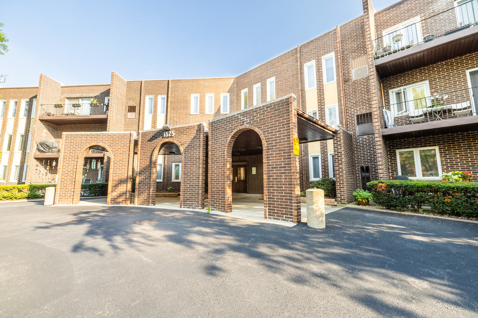 1525 Sander Court, Unit 103 Wheeling, IL 60090 - Photo 2 of 28 a view of a building with a street