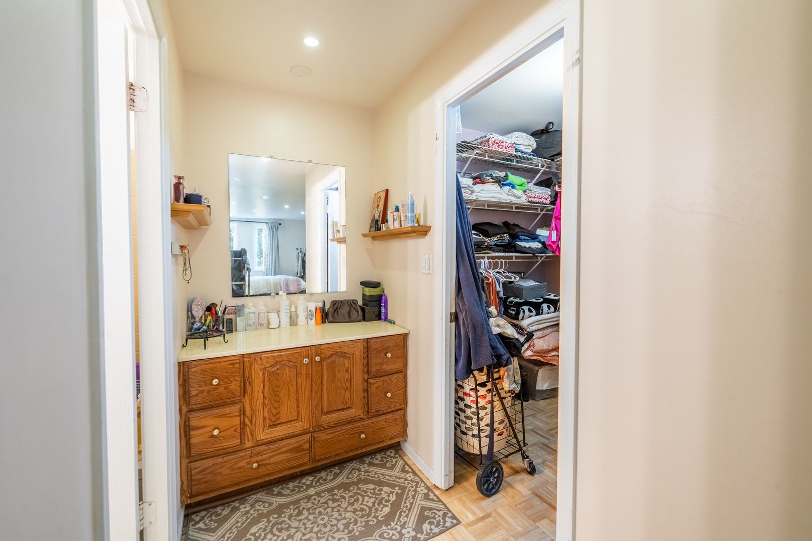 1525 Sander Court, Unit 103 Wheeling, IL 60090 - Photo 21 of 28 a room with a walk in closet and a mirror