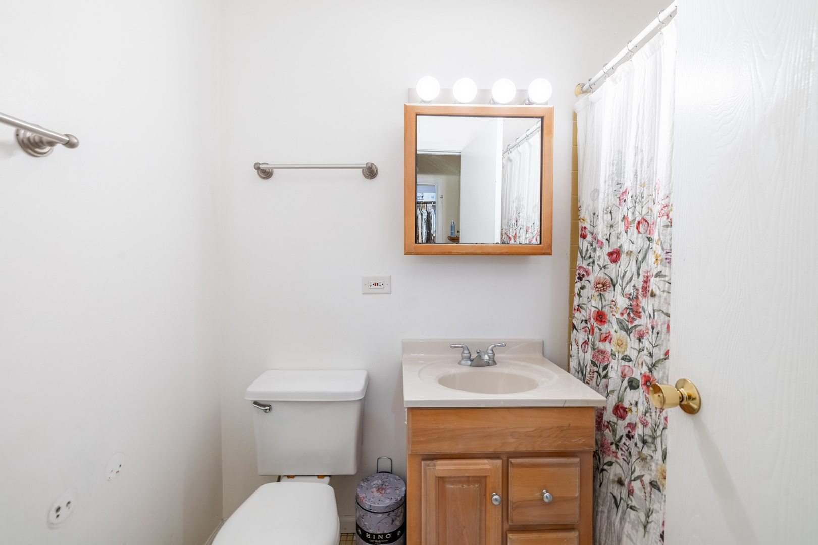 1525 Sander Court, Unit 103 Wheeling, IL 60090 - Photo 22 of 28 a bathroom with a toilet sink and mirror