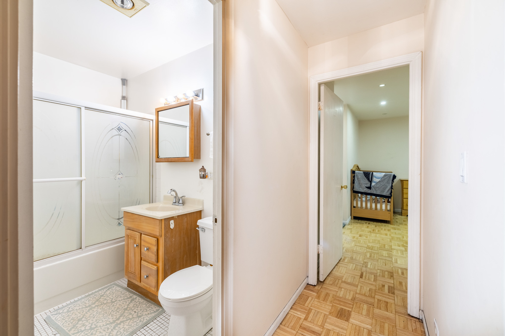 1525 Sander Court, Unit 103 Wheeling, IL 60090 - Photo 23 of 28 a bathroom with a toilet a sink and shower