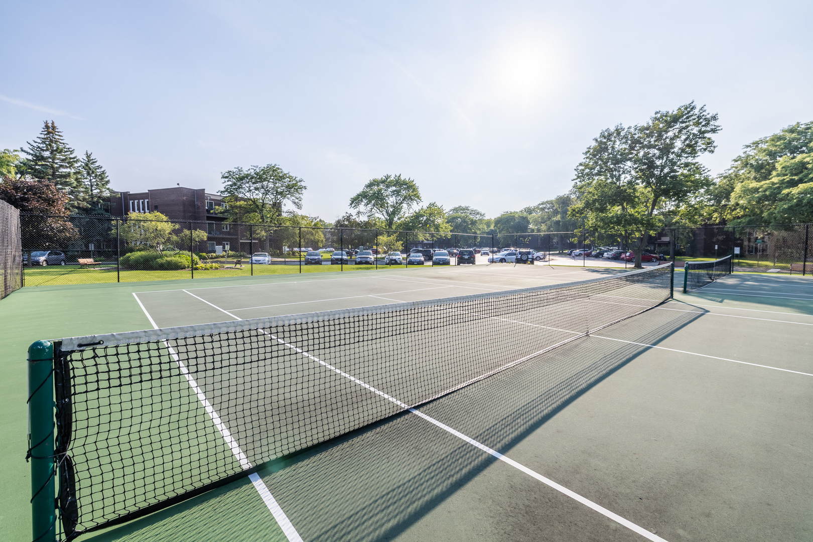 1525 Sander Court, Unit 103 Wheeling, IL 60090 - Photo 26 of 28 a view of an outdoor space and tennis court