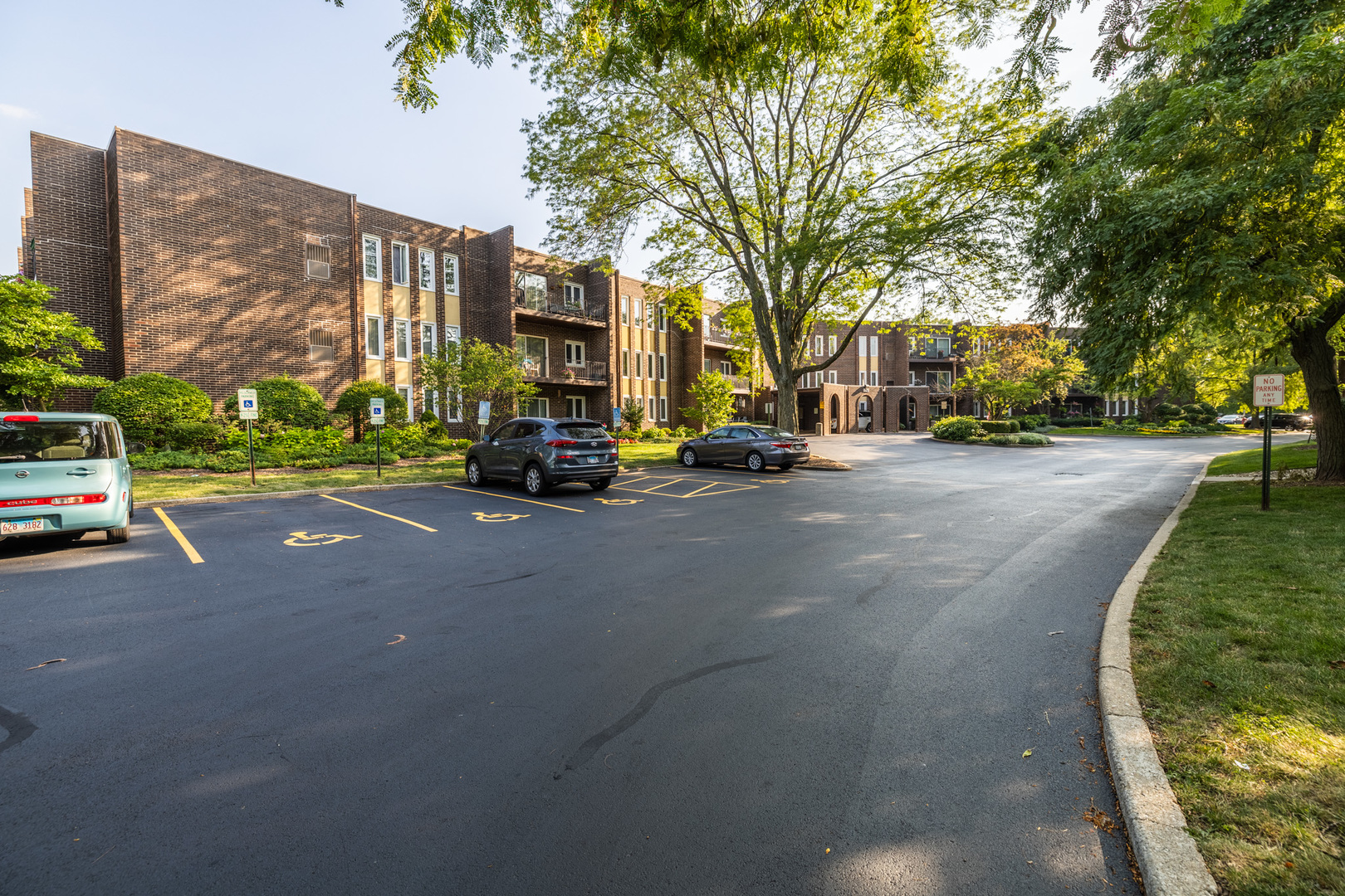 1525 Sander Court, Unit 103 Wheeling, IL 60090 - Photo 6 of 28 a view of a street with a cars side of the road