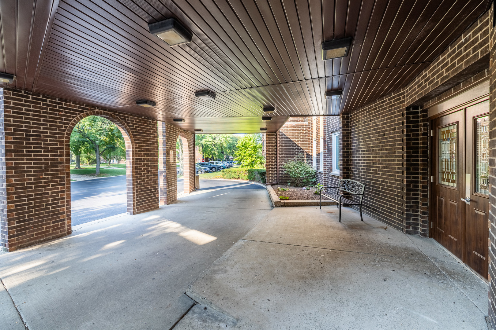 1525 Sander Court, Unit 103 Wheeling, IL 60090 - Photo 7 of 28 a view of a patio with table and chairs and wooden fence
