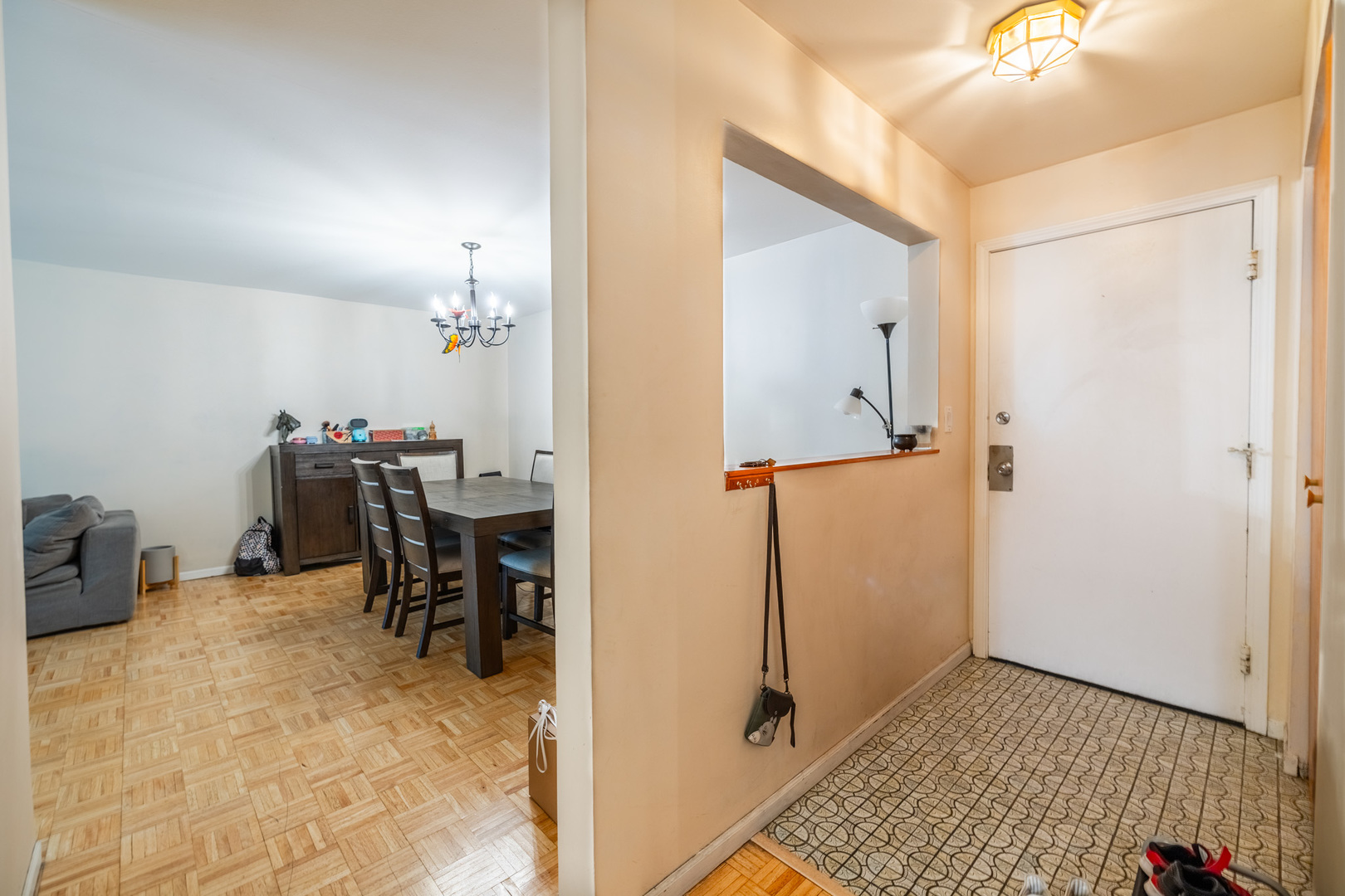 1525 Sander Court, Unit 103 Wheeling, IL 60090 - Photo 8 of 28 a view of a hallway with workspace and a window