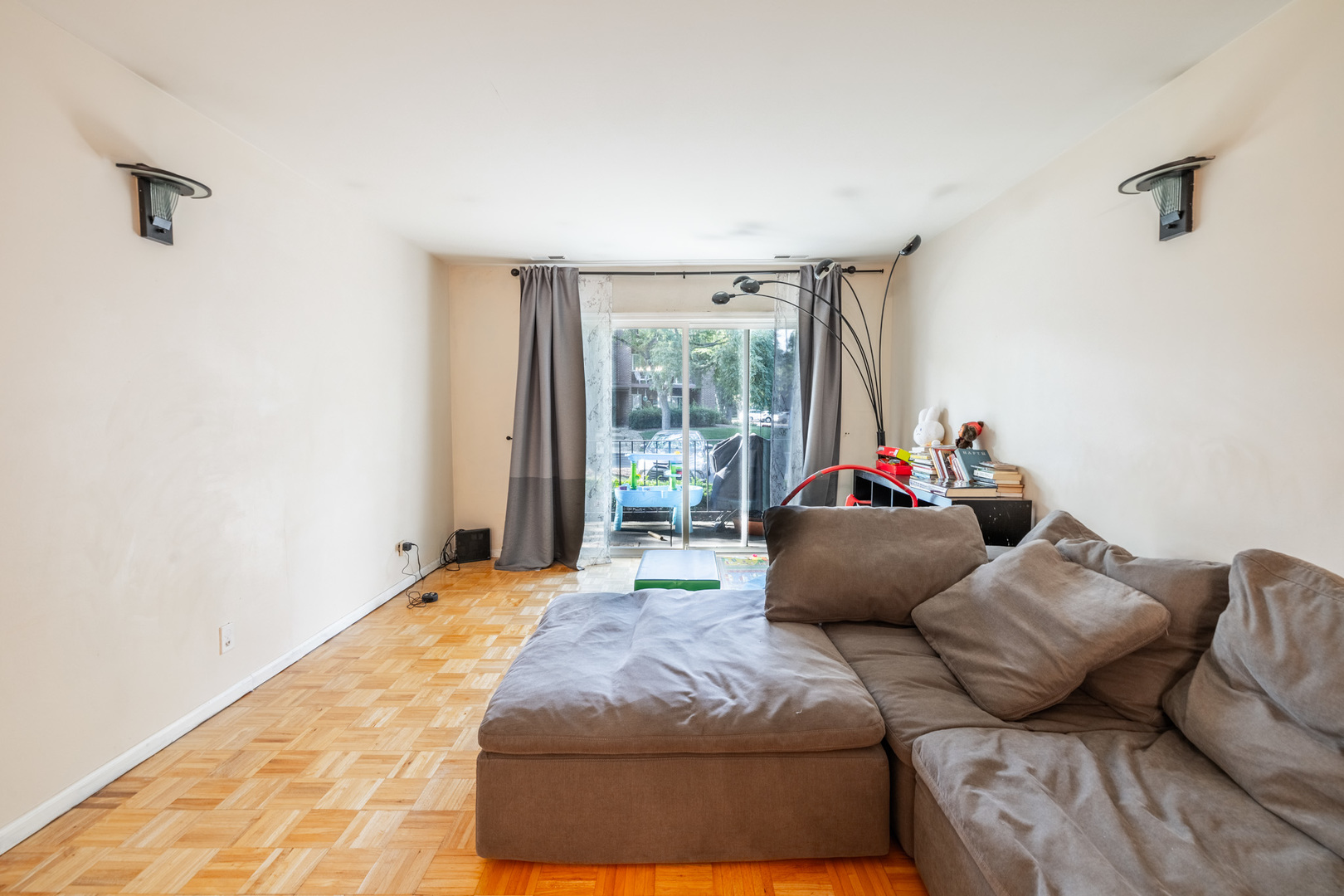 1525 Sander Court, Unit 103 Wheeling, IL 60090 - Photo 9 of 28 a living room with a couch and a window