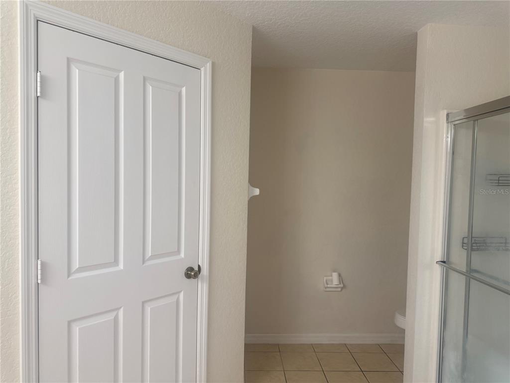 927 Reserve Place Davenport, FL 33896 - Photo 12 of 18 a view of a closet area